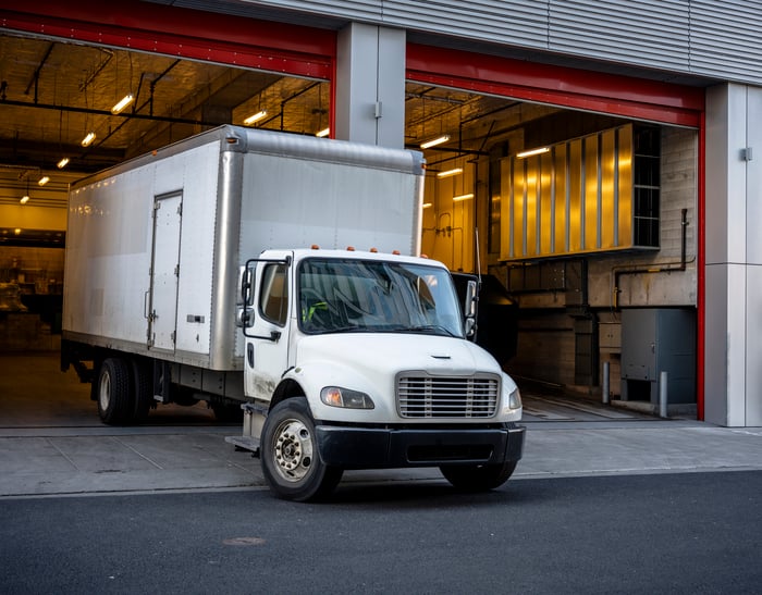 Box truck pulling out of a warehouse