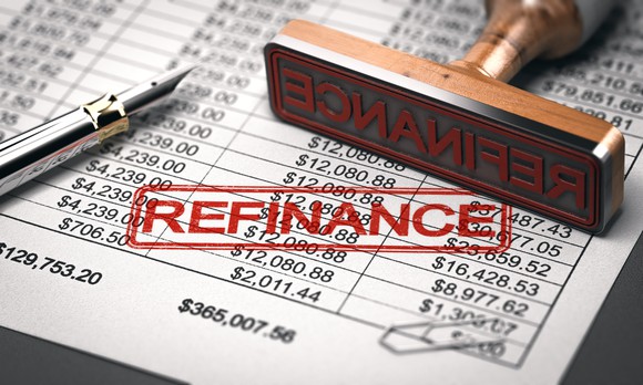 Accounting sheet stamped with the word Refinance