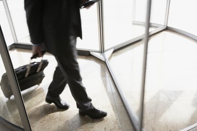 businessman in revolving door