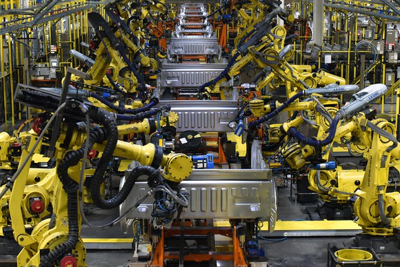 Pickup-truck body sections on an assembly line.