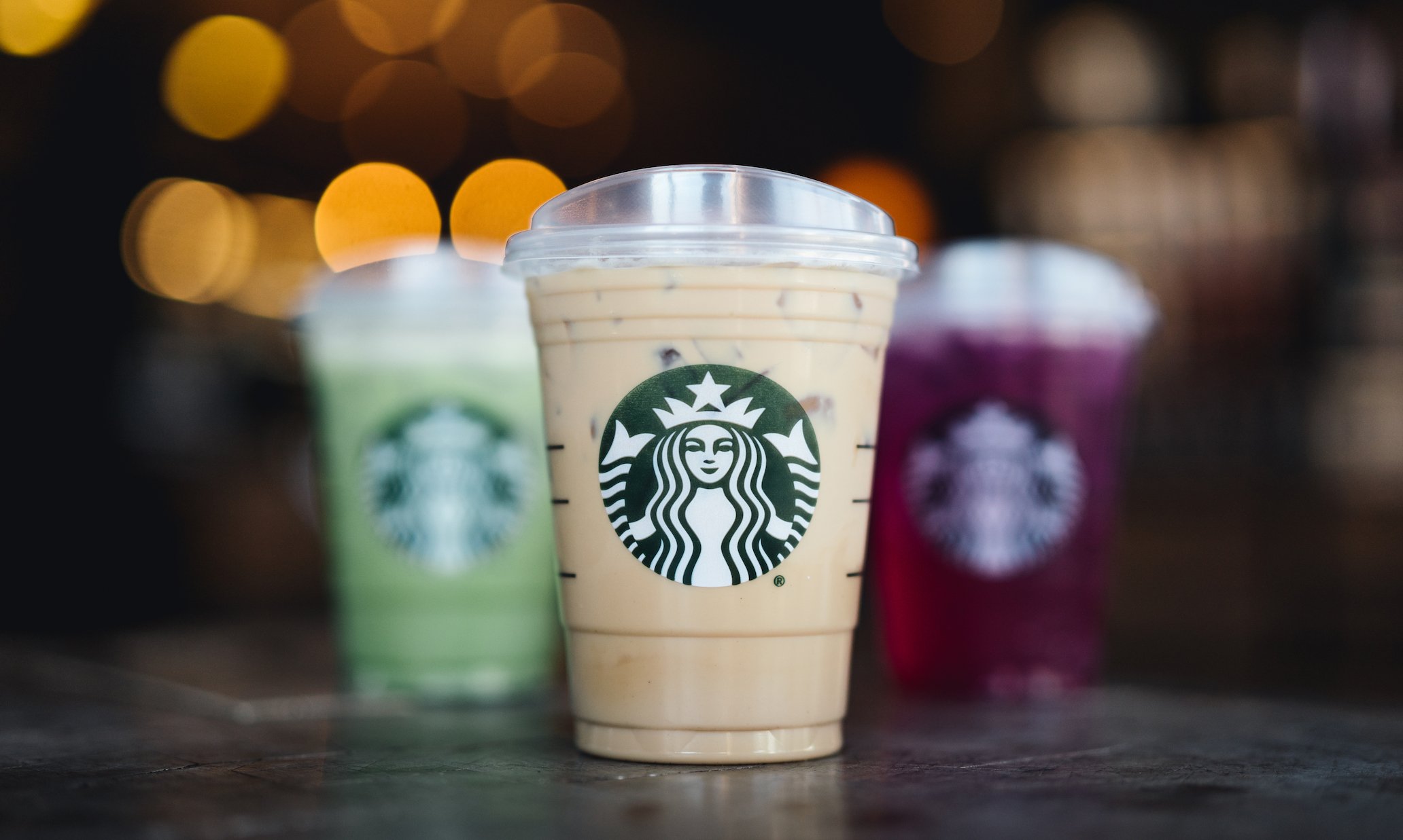 Three cold cups with Starbucks logos.