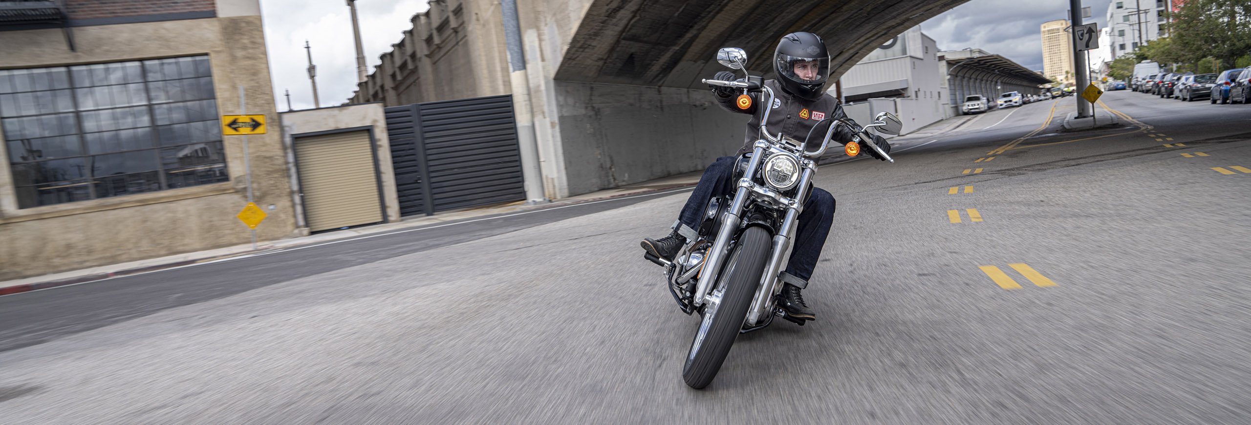 Man riding a Harley-Davidson motorcycle.