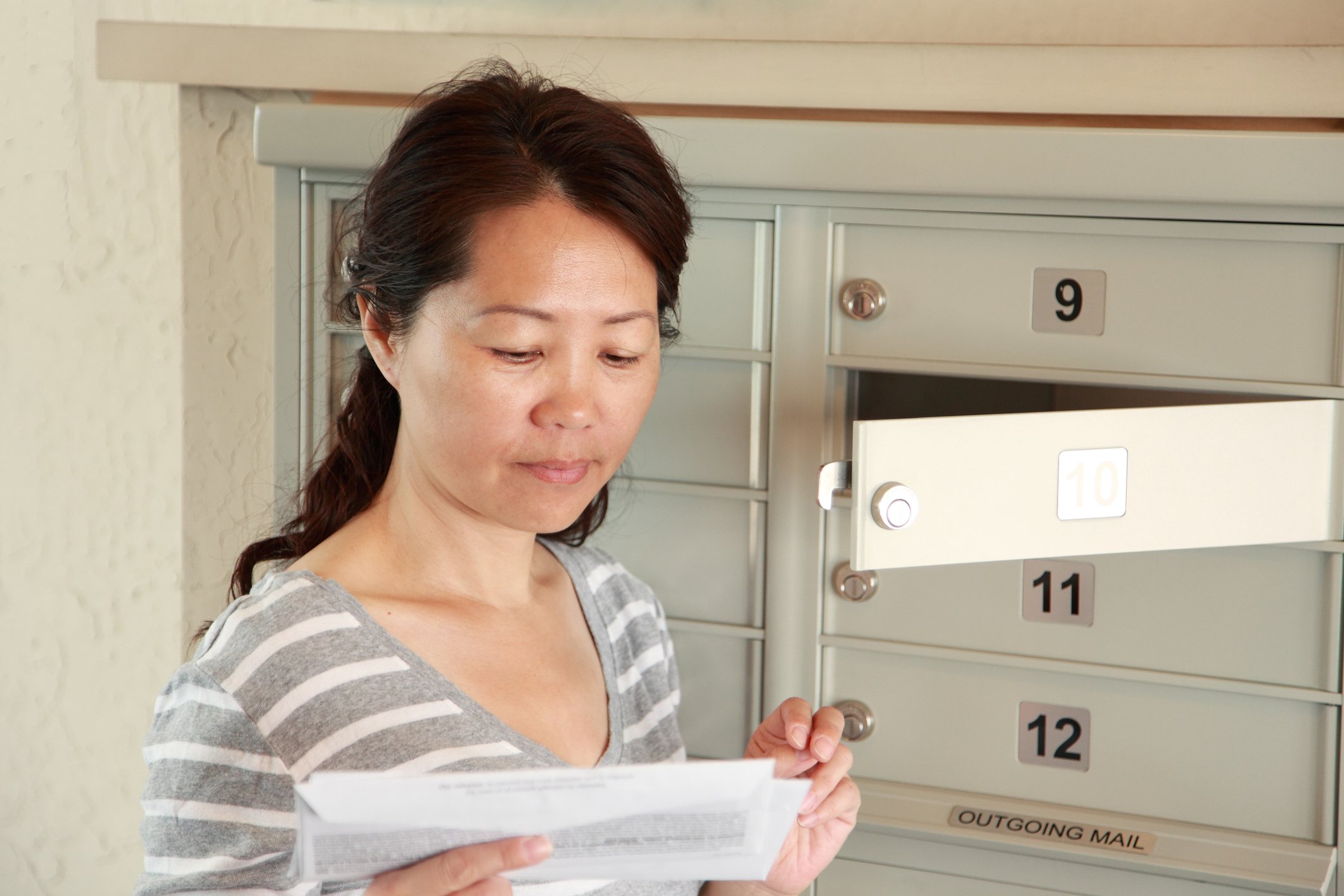 Woman checking mailbox