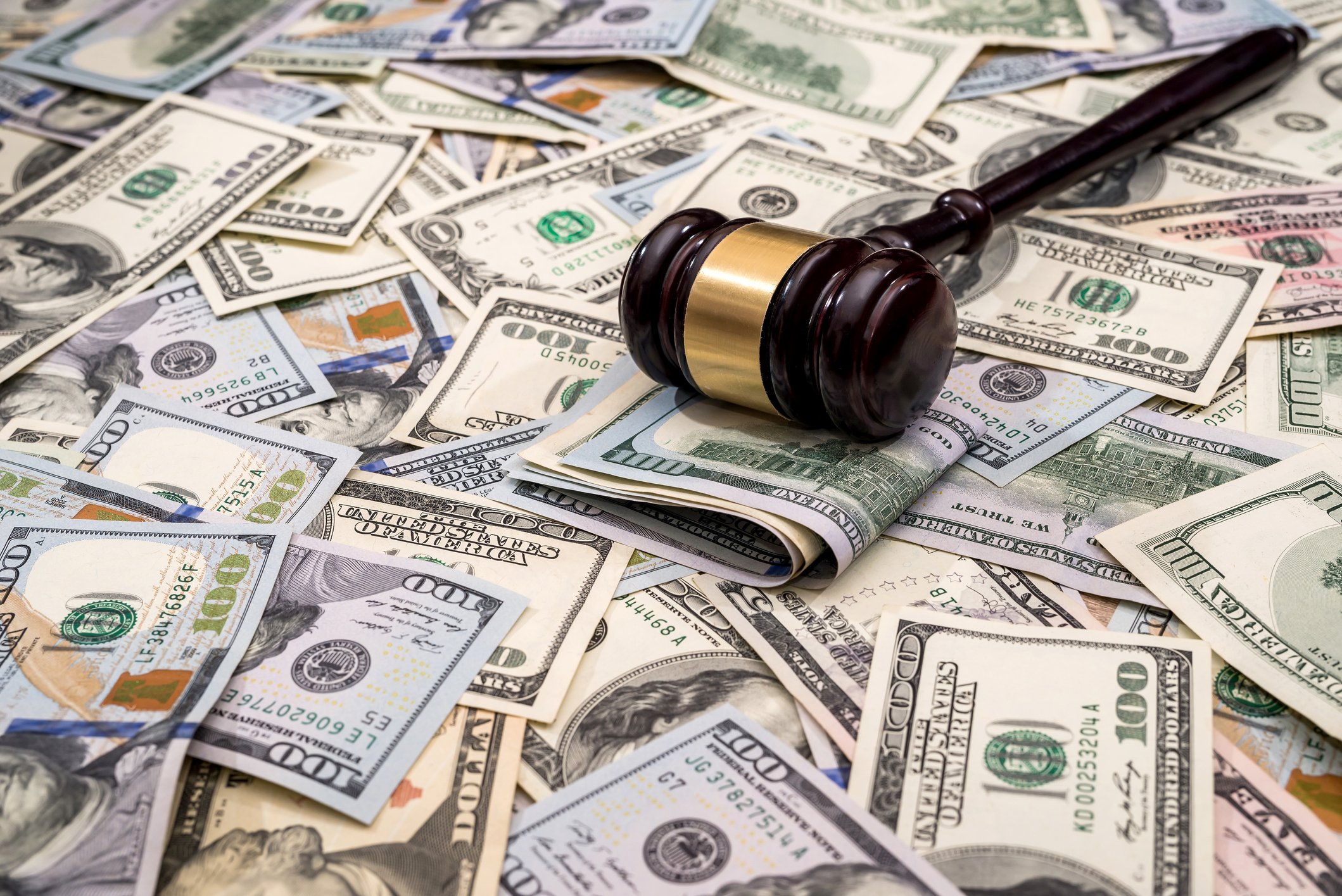 Gavel atop pile of money