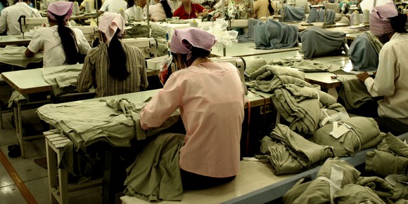 Garment factory workers sewing in a factory