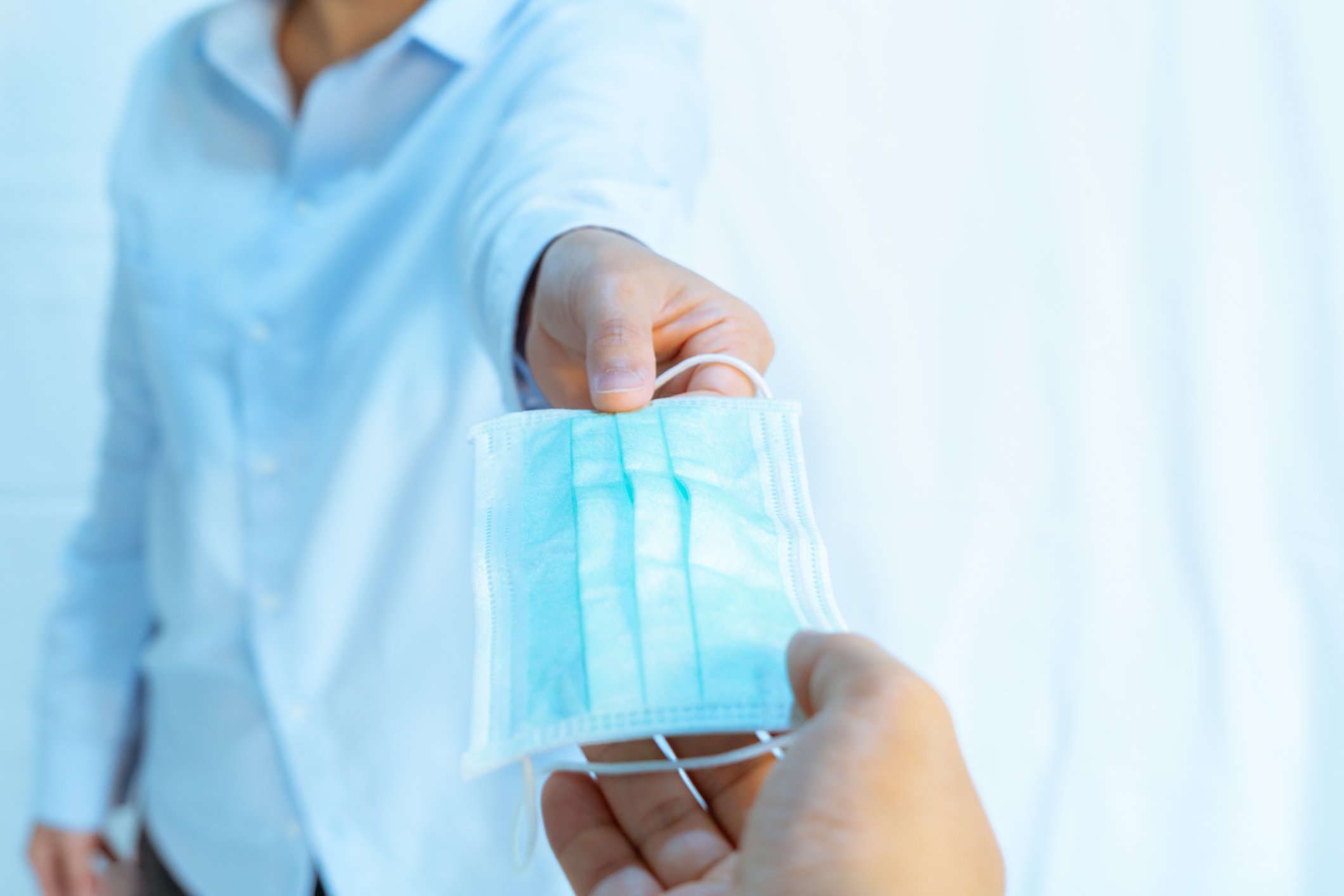 Handing out surgical masks.