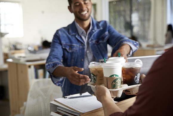 A person delivers Starbucks.