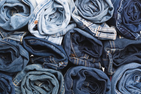 Several stacks of rolled-up jeans.