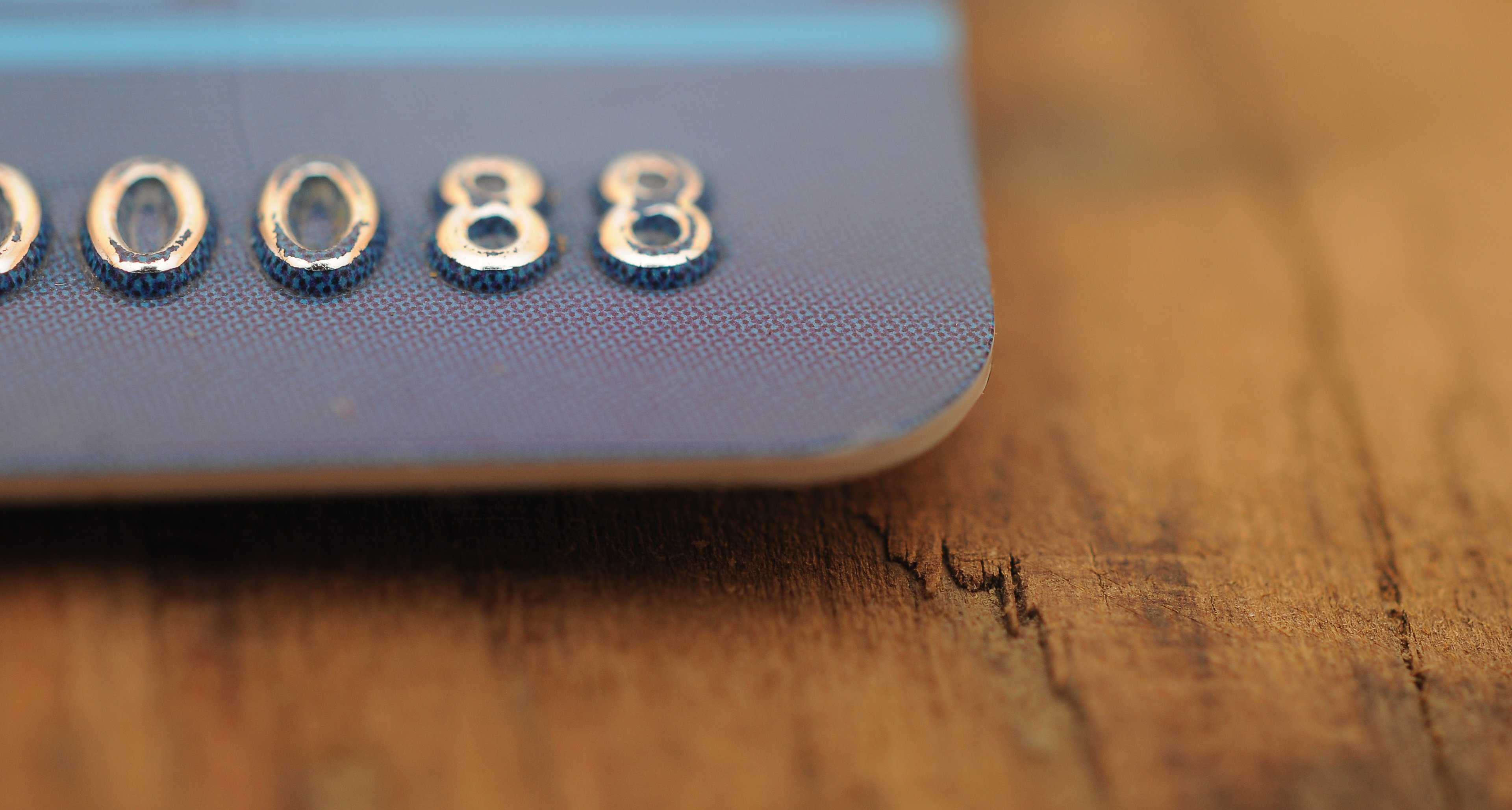 The corner of a credit card, showing the last few digits of the account number