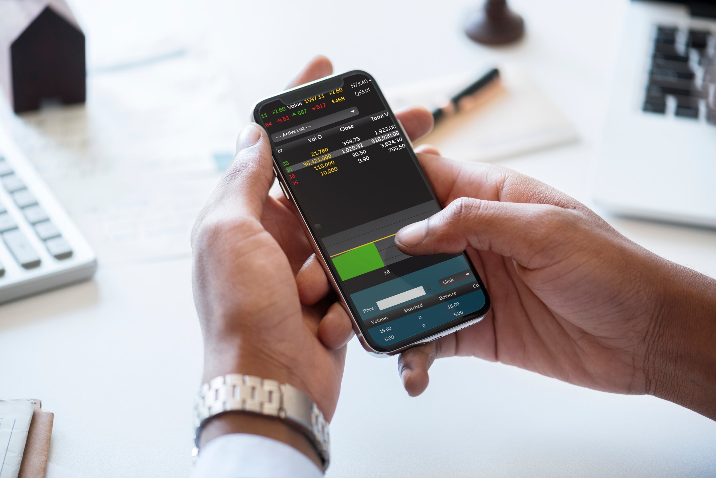 Person trading stocks on a phone.