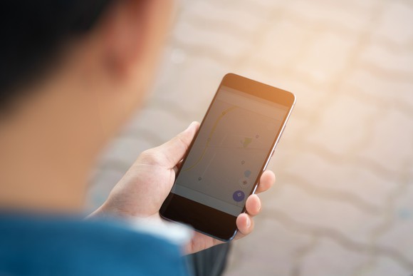 Person checking map on smartphone. 