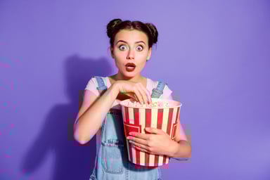 Shocked lady with huge popcorn bucket