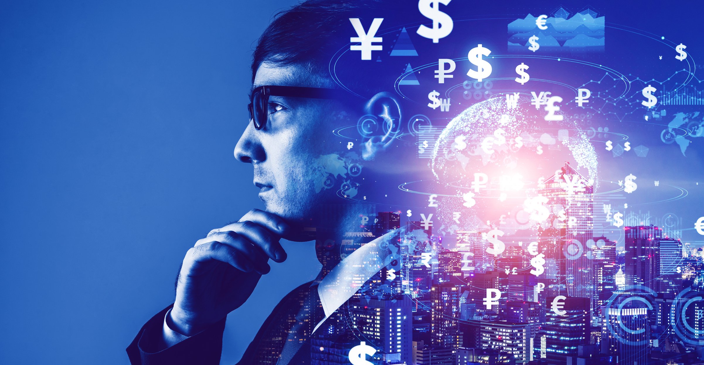 A man in a suit and glasses faces camera left thinking while behind his head symbols of international currency gloat over a limunescent graphic of the world. 