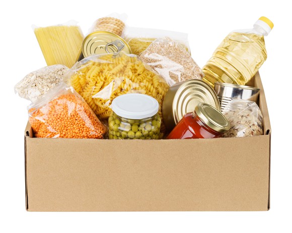 A box of canned and packaged staple foods.