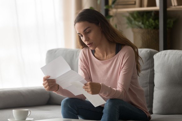 Woman reading a letter. 