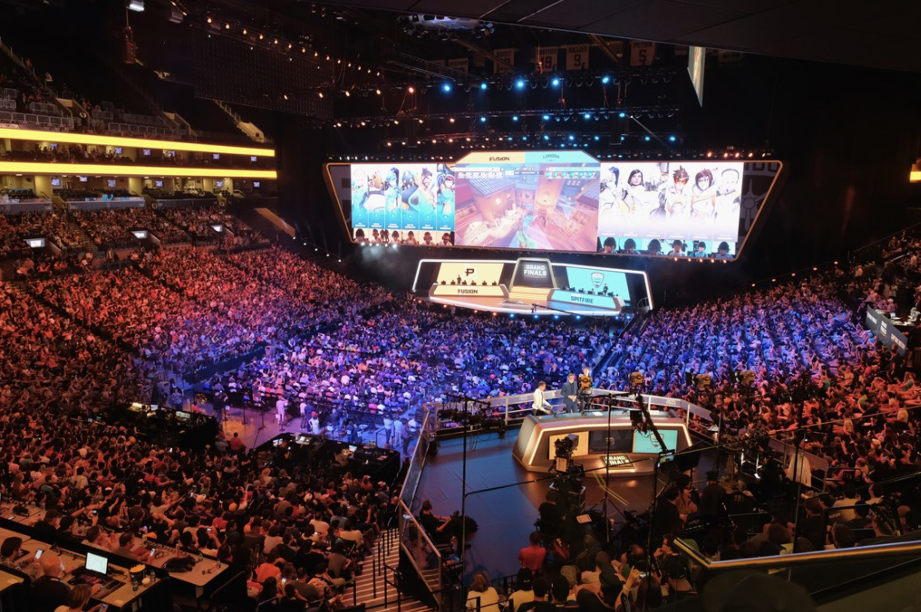 A large crowd packed in an arena to watch Overwatch League.