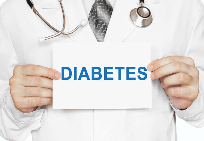 Doctor wearing a sign that says diabetes.