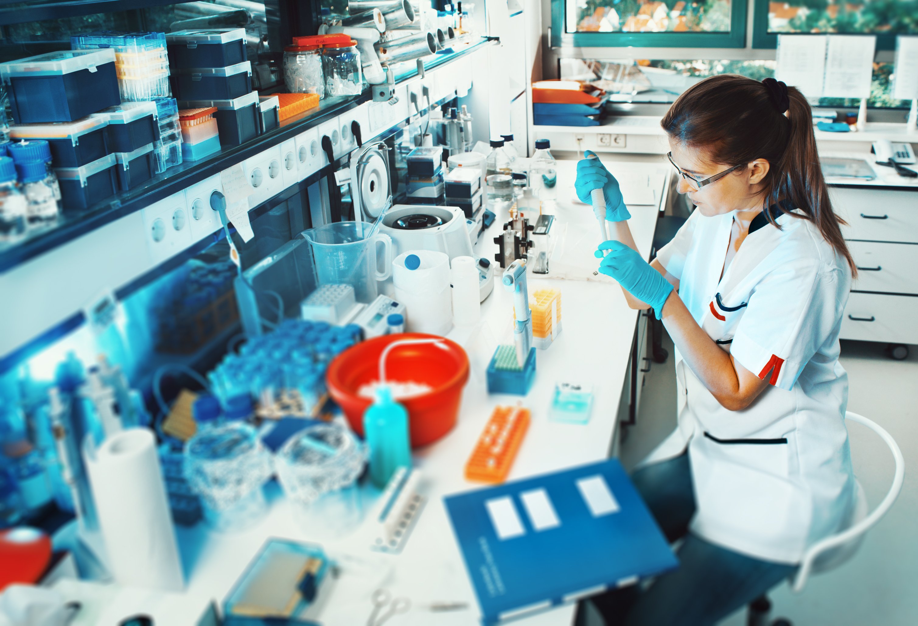 A scientist working at a lab bench.