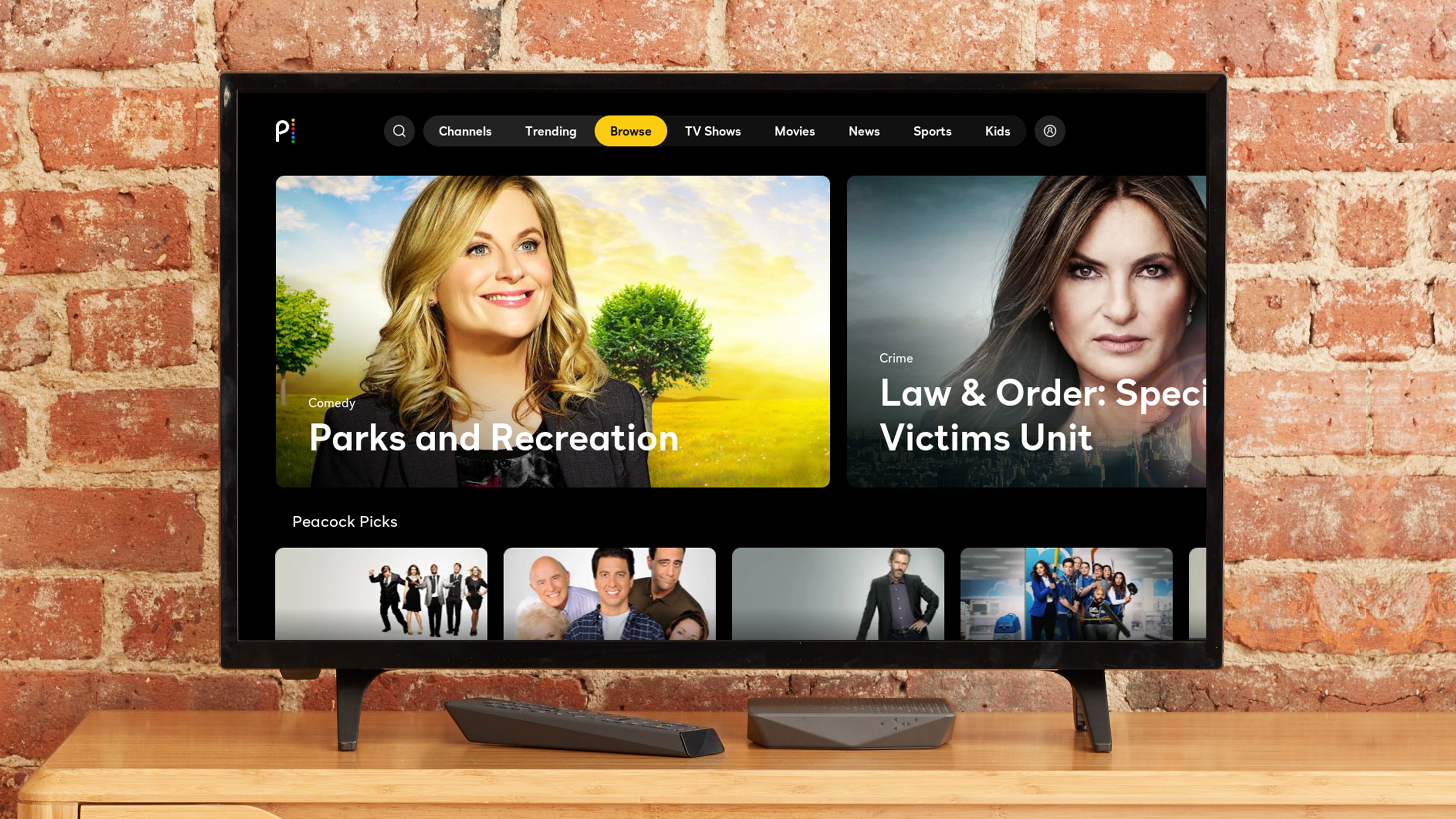 A TV featuring Peacock program with a brick wall in the background