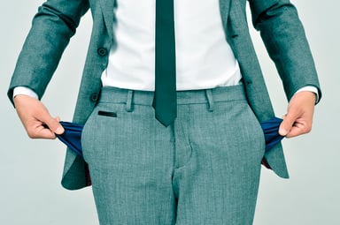 Businessman showing empty pockets