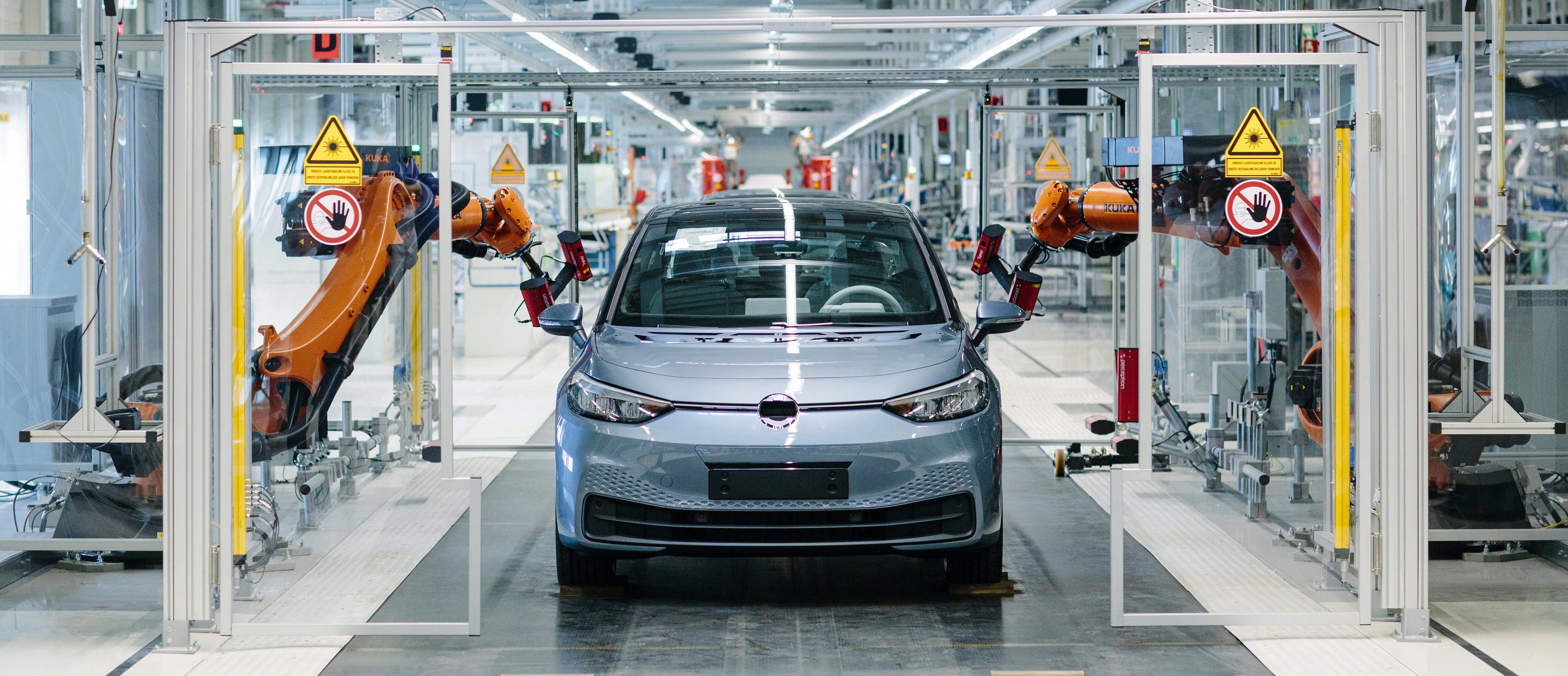 Robots attend to a VW ID.3 hatchback on the production line at VW's Zwickau factory.
