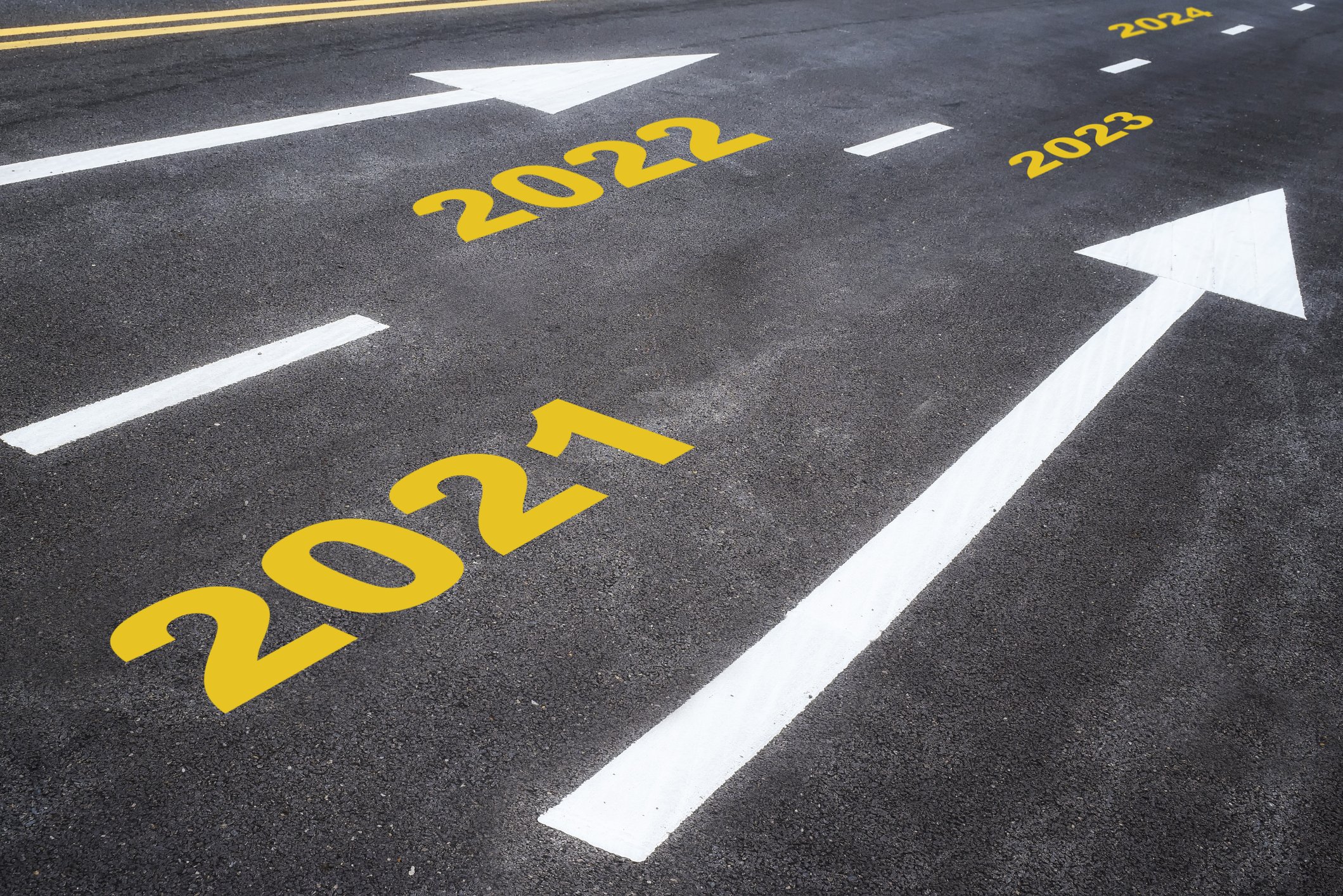2021, 2022, 2023, 2024, and arrows painted on a road