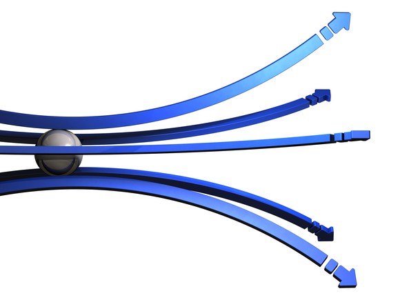 Metal ball rolling toward diverging blue arrows.