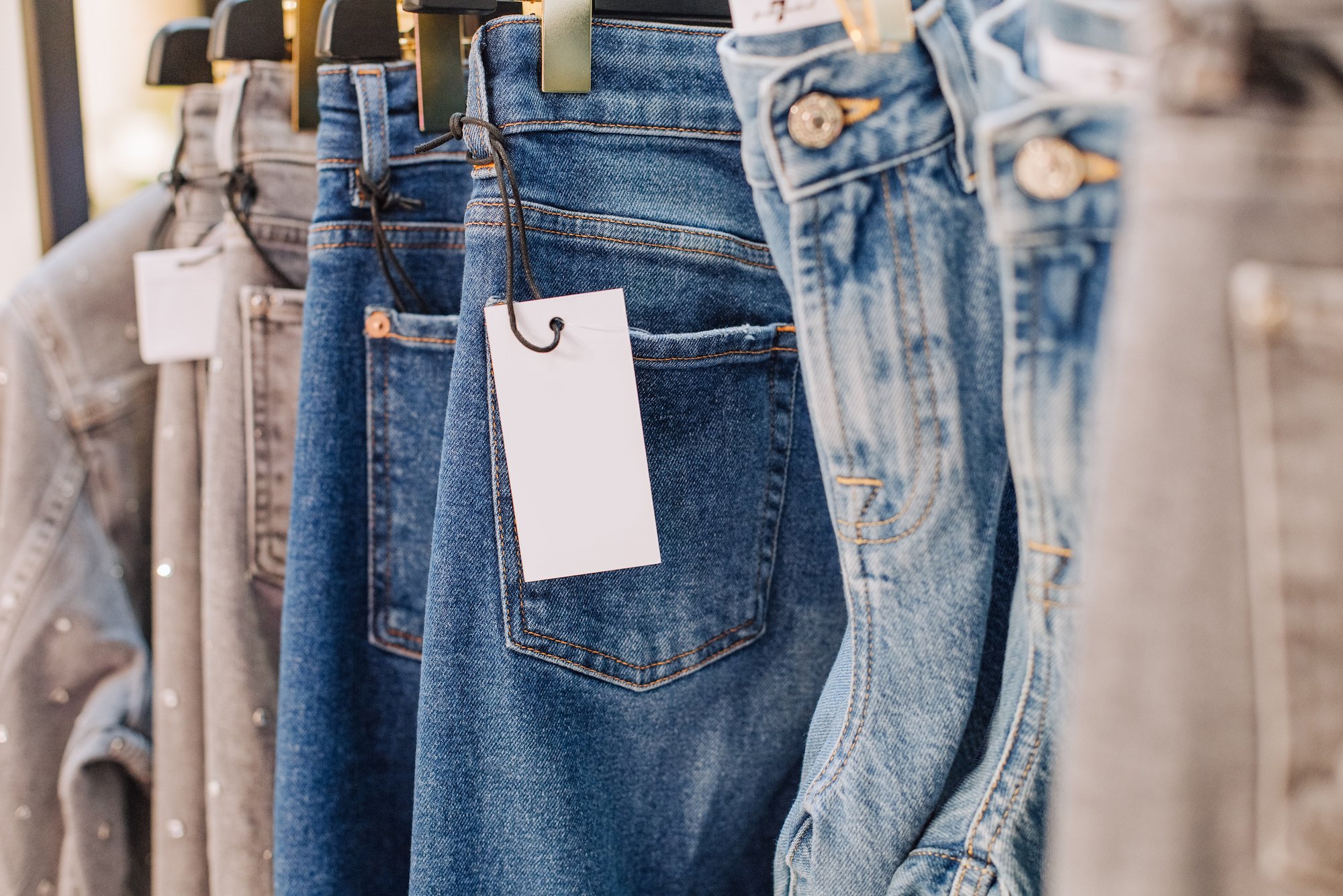 A rack of jeans in a clothing store