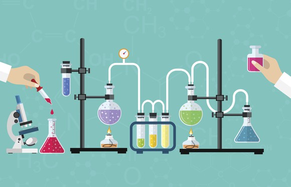 People adding liquid to network of test tubes
