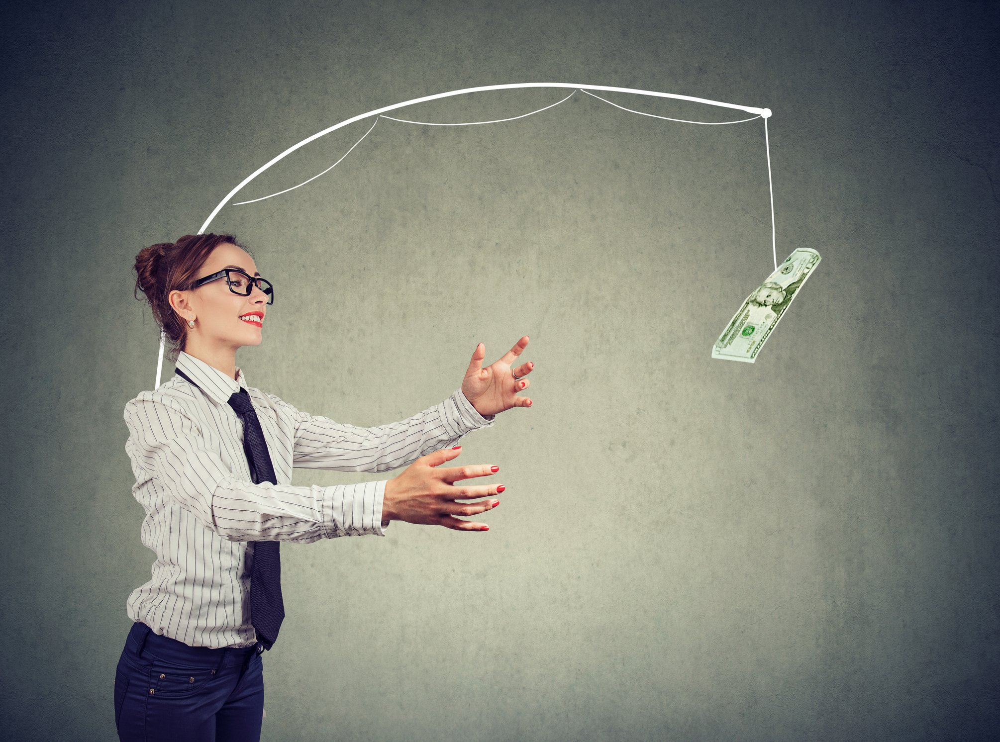 A woman follows money attached to a fishing rod.