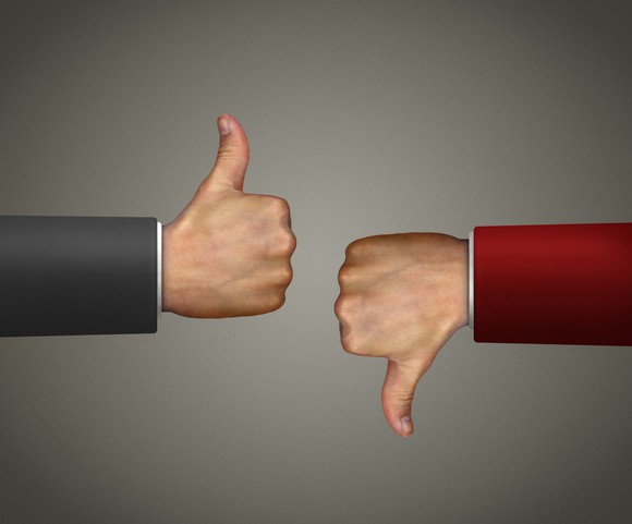 One thumbs up and one thumbs down sign.