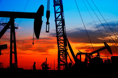 An oil field at sunset.