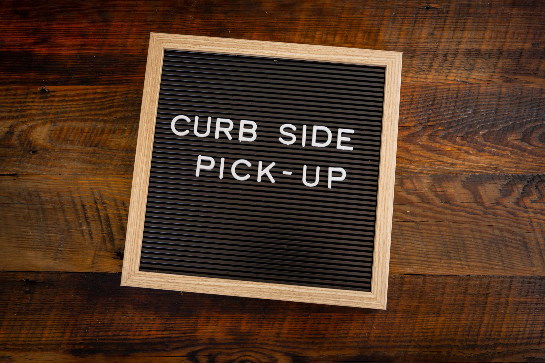 A curbside pickup sign.