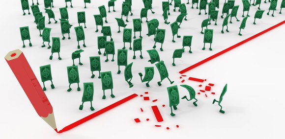 A pencil drawing a huge red line, as dollar bills with little legs rush through a hole in the line.