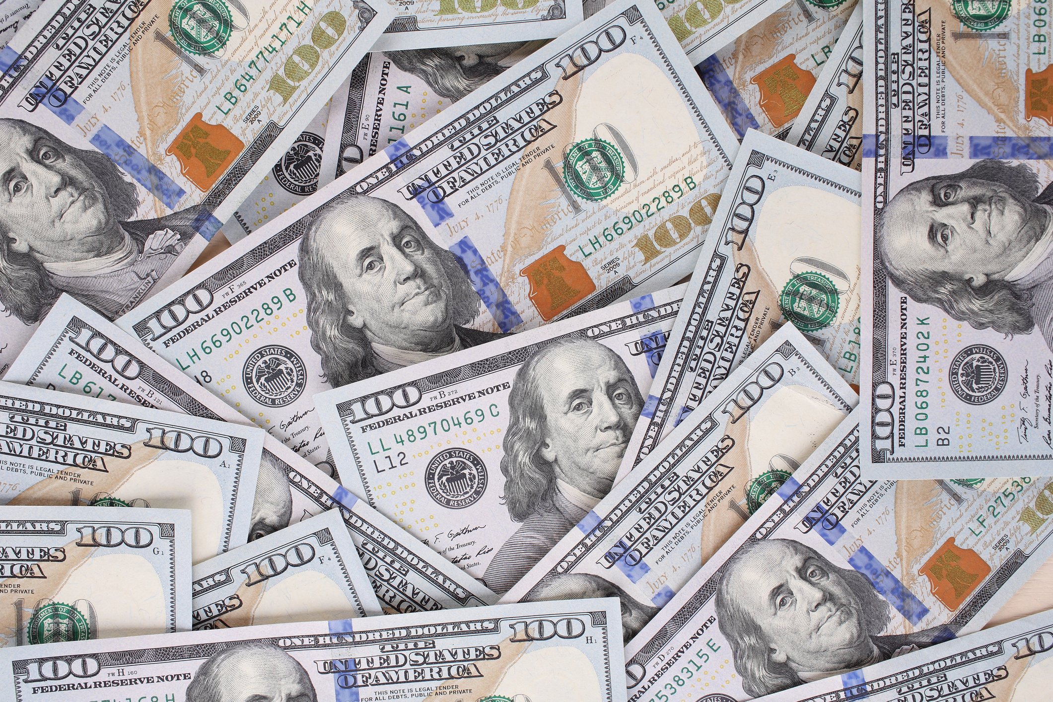 Loose pile of hundred-dollar bills