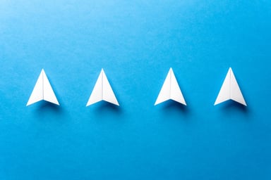 Four arrows pointing up