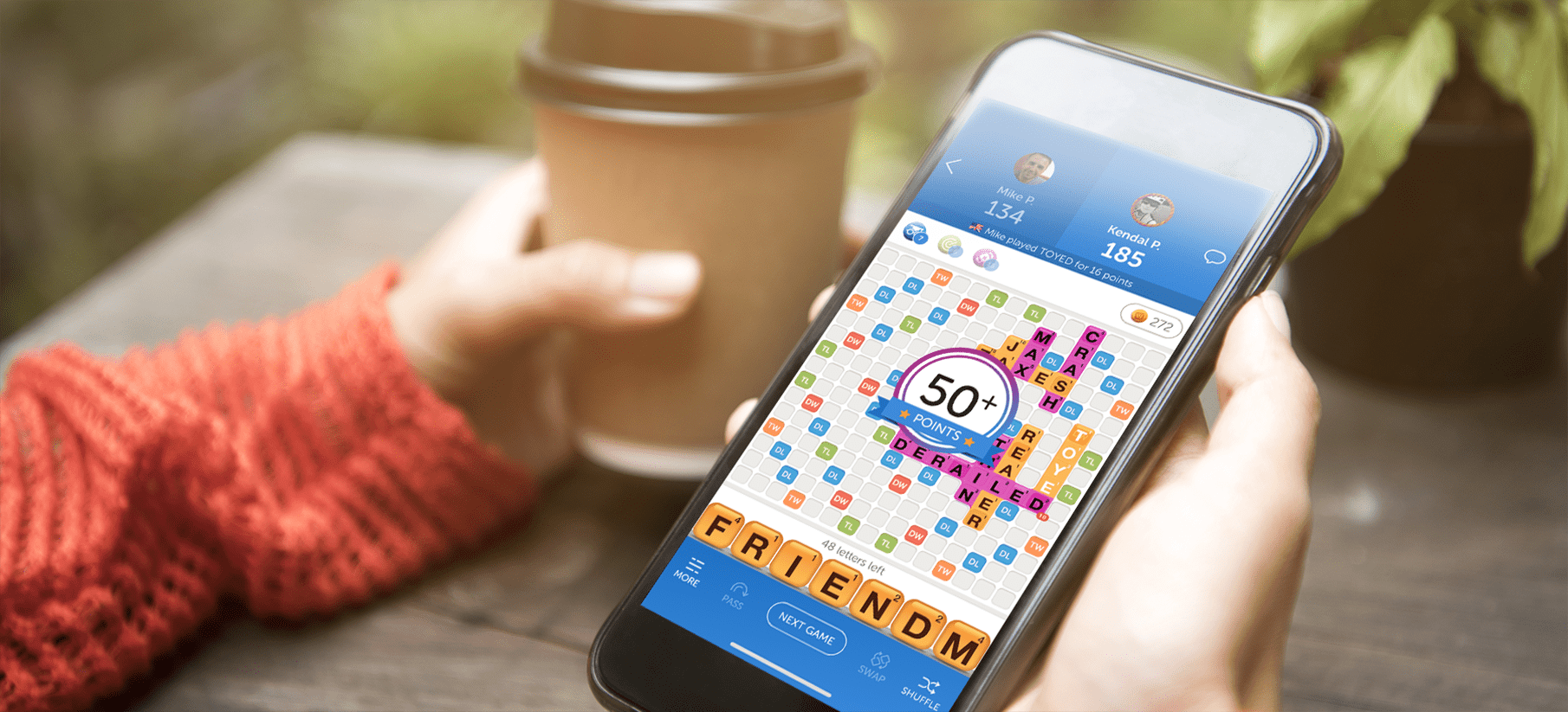 A person playing Zynga's 'Words With Friends' on a mobile phone.