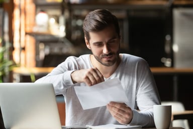 man-opening-envelope