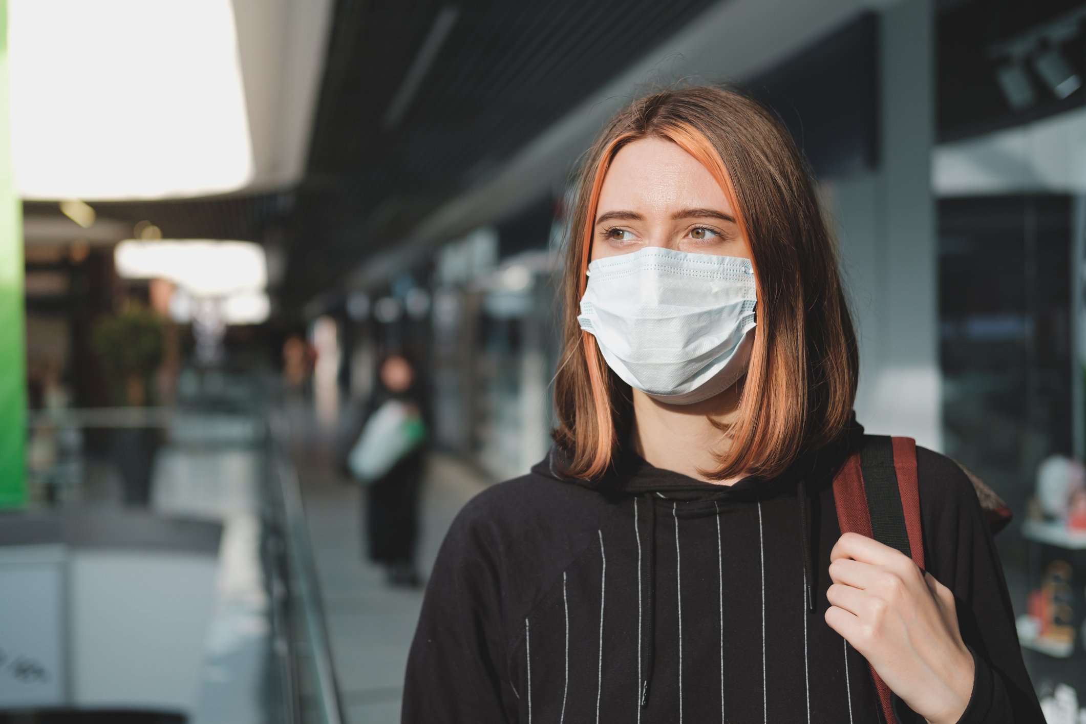 Woman wearing mask in shopping mall