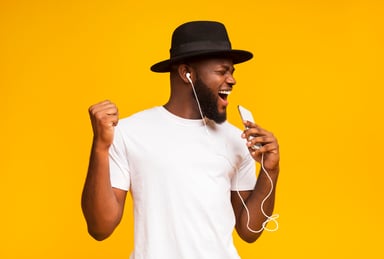 man happily listens to music