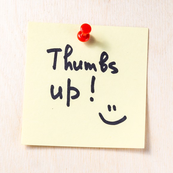 A sticky note saying Thumbs Up.