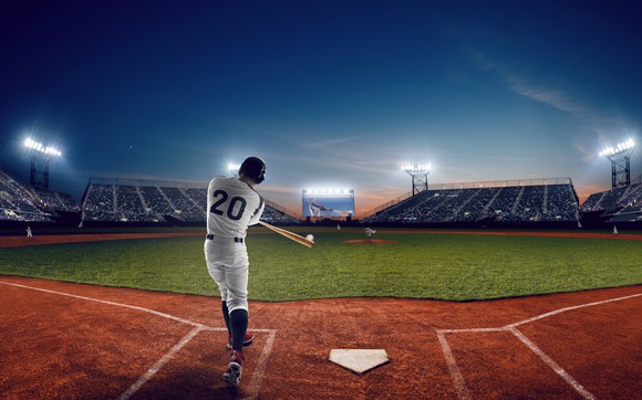 Baseball player hitting a ball during a game. 
