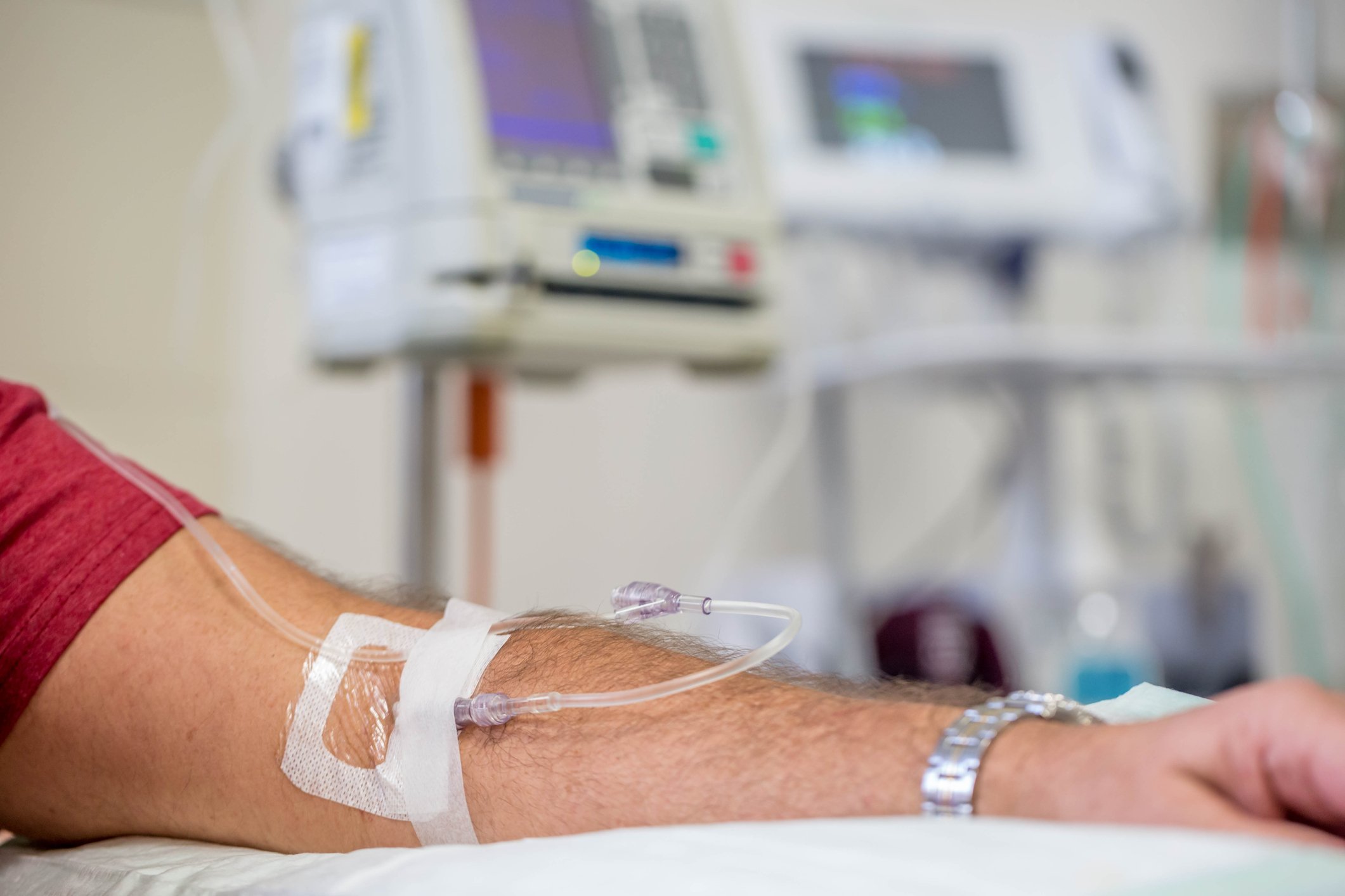 Arm of man receiving IV infusion