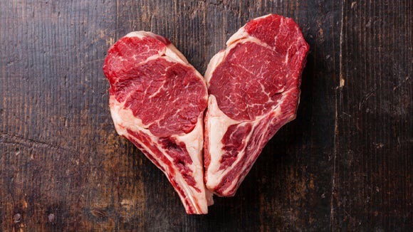 Two ribeye steaks in a heart shape