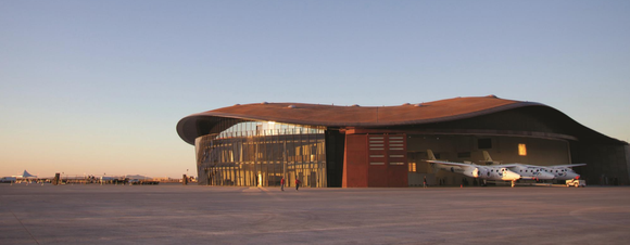 A plane in front of Spaceport America.