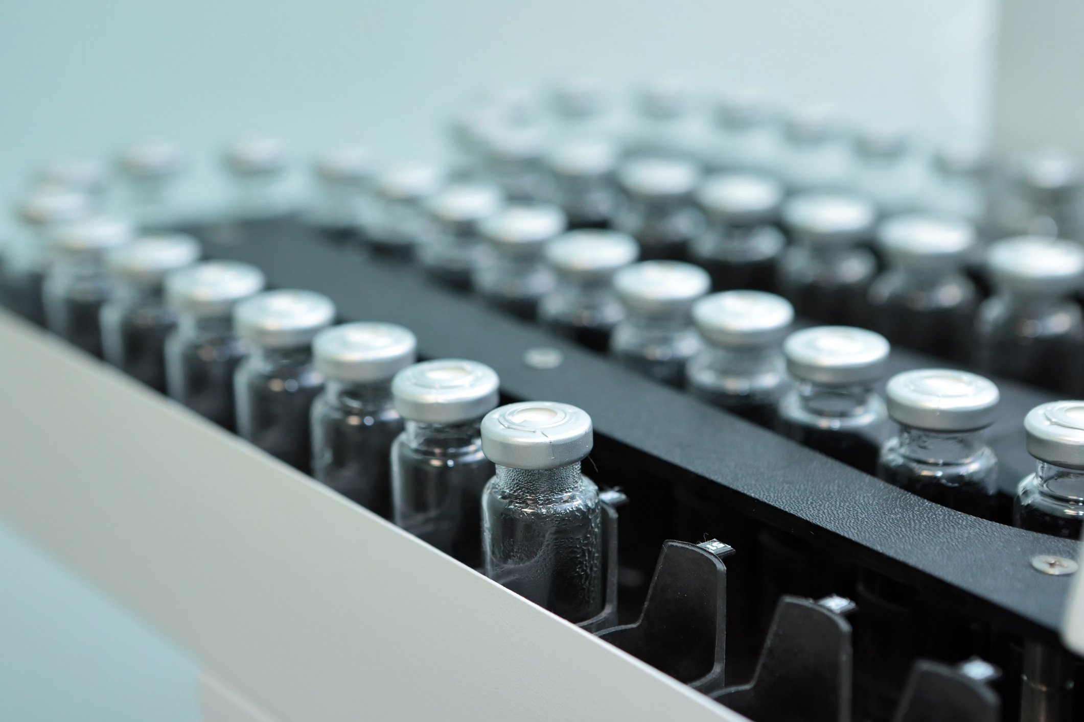 Vials of drugs on a manufacturing line