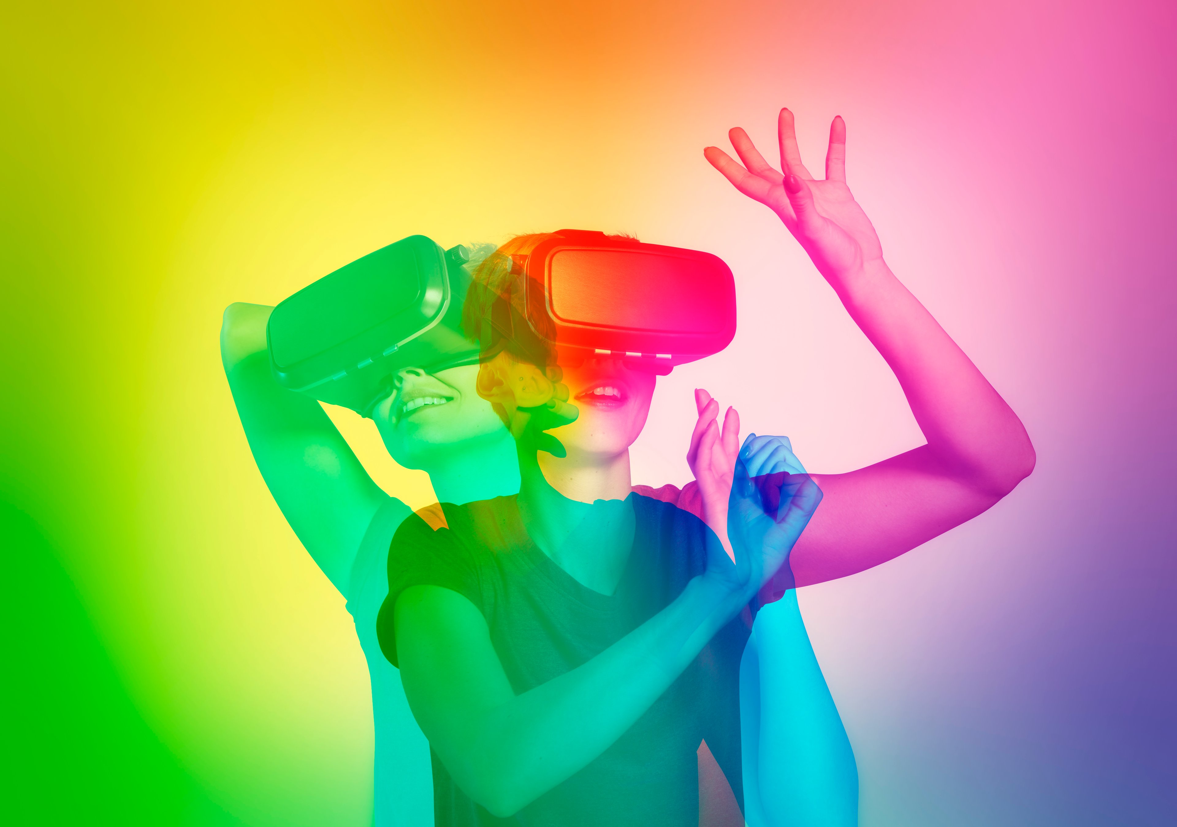 A girl wearing VR glasses and playing a game. 