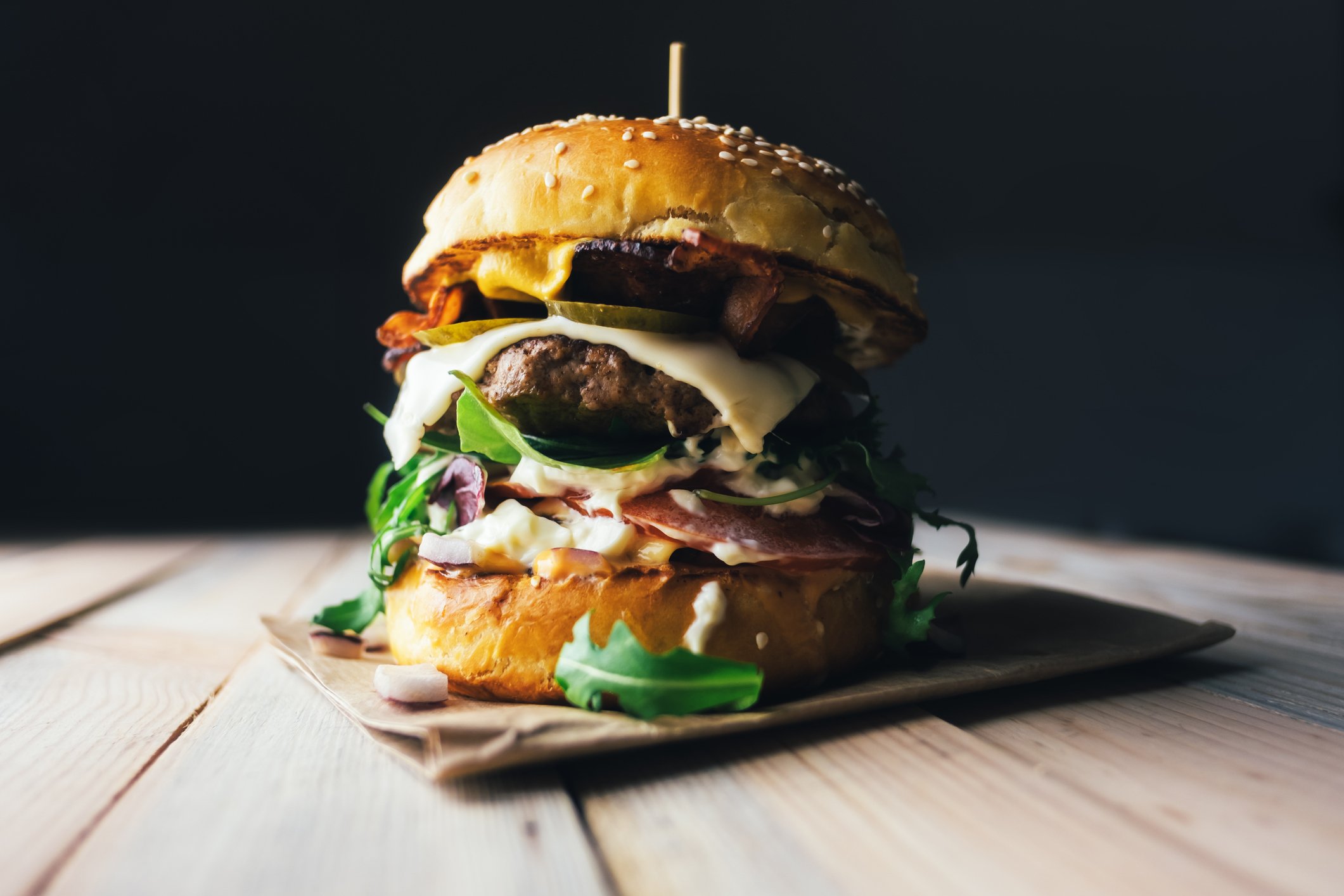 Gourmet cheeseburger with multiple toppings