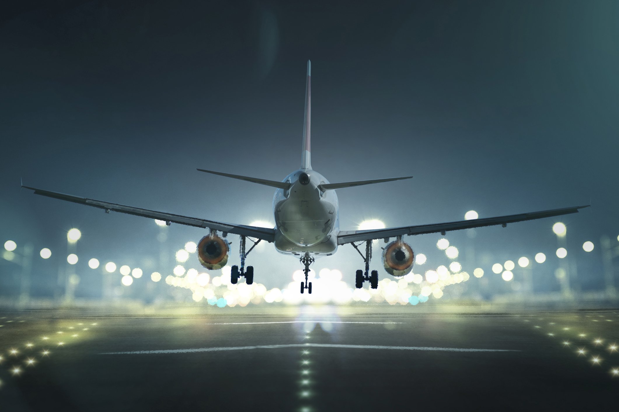 An airplane landing at night.
