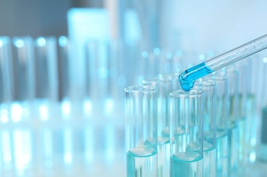 dropper filling vials in lab